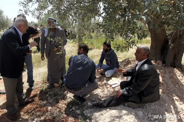 Palestinian Prime Minister Salam Fayyad, participates in the Sixth International Conference of the Bil'in popular resistance, in the village of Bil'in, in the West Bank city of Ramallah April 10, 2012. Photo by Mustafa A...