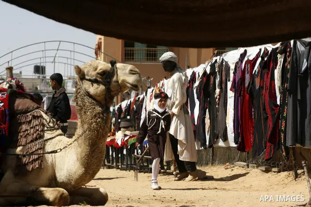Palestinians take part in the exhibition for the palestinian heritage organized by Dar al-Fadela school in the southern Gaza Strip town of Rafah on April 11, 2012. The exhibition displays the Palestinian heritage works f...