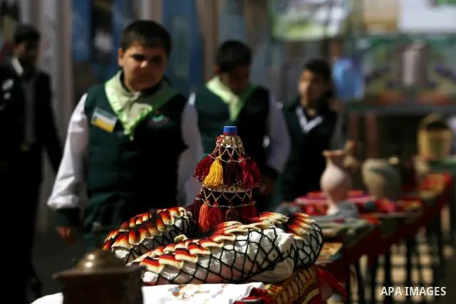 Palestinians take part in the exhibition for the palestinian heritage organized by Dar al-Fadela school in the southern Gaza Strip town of Rafah on April 11, 2012. The exhibition displays the Palestinian heritage works f...