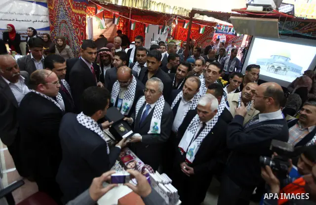 Palestinian Prime Minister Salam Fayyad attend Opening Ceremony of the food industry exhibition at the University of Hebron in west bank city of Hebron on April 11, 2012 Fayyad Inspect the first exhibition of agricultura...