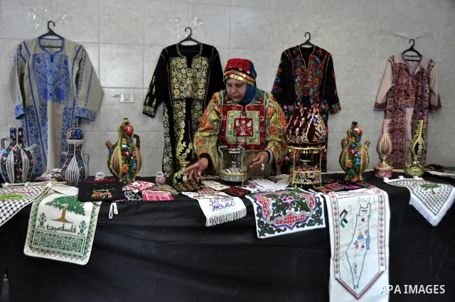 Palestinians participate in an exhibition in the first Palestinian Heritage Jerusalem, in the West Bank city of Nablus, April. 14, 2012. Photo by Nedal Shtieh.