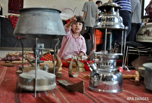 Palestinians participate in an exhibition in the first Palestinian Heritage Jerusalem, in the West Bank city of Nablus, April. 14, 2012. Photo by Nedal Shtieh.