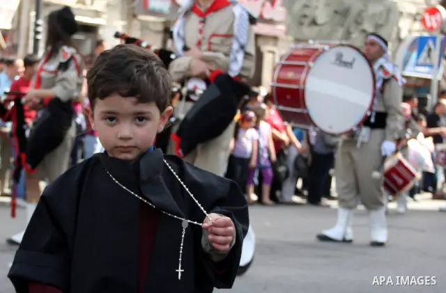 Palestinian Christians take part in the "Holy Fire" procession on the eve of Orthodox Easter in the West Bank city of Ramallah on April 14, 2012. The date of Orthodox Easter is calculated differently than by the Roman Ca...