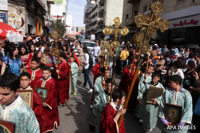 Palestinian Christians take part in the "Holy Fire" procession on the eve of Orthodox Easter in the West Bank city of Ramallah on April 14, 2012. The date of Orthodox Easter is calculated differently than by the Roman Ca...