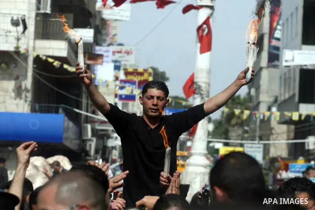 Palestinian Christians take part in the "Holy Fire" procession on the eve of Orthodox Easter in the West Bank city of Ramallah on April 14, 2012. The date of Orthodox Easter is calculated differently than by the Roman Ca...