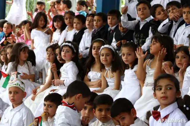 Palestinian children take part in a celebration to mark the International Children Day in Gaza city on April, 15, 2012. Photo by Ashraf Amra