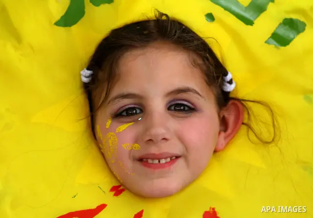 Palestinian children take part in a celebration to mark the International Children Day in Gaza city on April, 15, 2012. Photo by Ashraf Amra