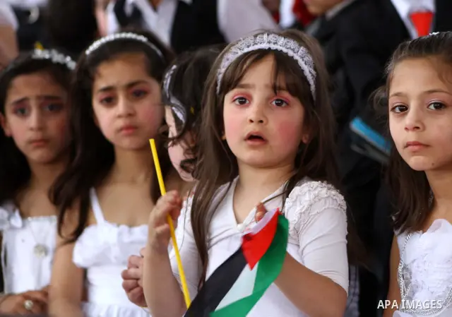 Palestinian children take part in a celebration to mark the International Children Day in Gaza city on April, 15, 2012. Photo by Ashraf Amra