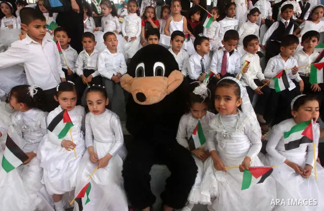 Palestinian children take part in a celebration to mark the International Children Day in Gaza city on April, 15, 2012. Photo by Ashraf Amra