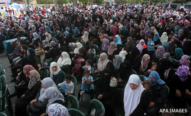 Palestinian women take part in a celebration to mark the International Children Day in Gaza city on April, 15, 2012. Photo by Ashraf Amra