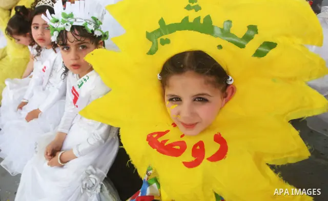 Palestinian children take part in a celebration to mark the International Children Day in Gaza city on April, 15, 2012. Photo by Ashraf Amra