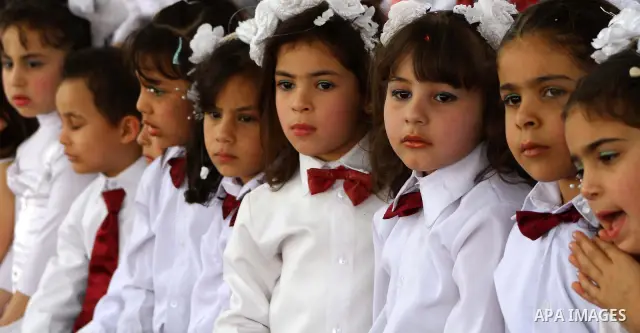 Palestinian children take part in a celebration to mark the International Children Day in Gaza city on April, 15, 2012. Photo by Ashraf Amra