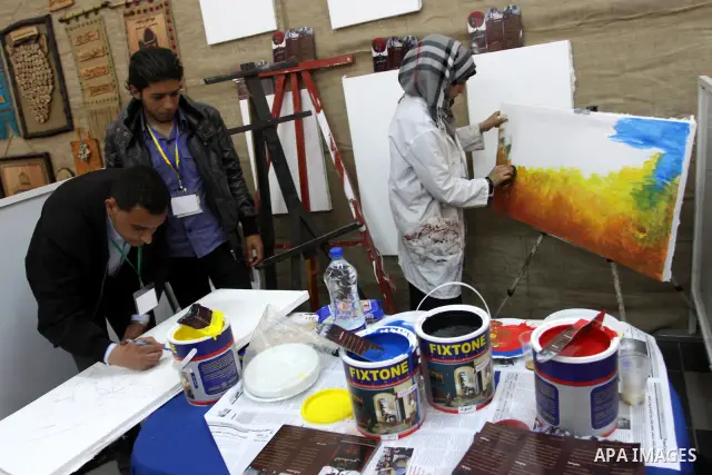 Palestinians participate in an exhibition Palestinian Heritage in Islamic University in Gaza City, on April, 15, 2012. Photo by Mohammed Asad