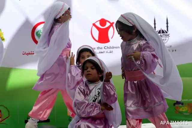 Palestinian children take part in a celebration to mark the International Children Day in Gaza city on April, 15, 2012. Photo by Mohammed Asad