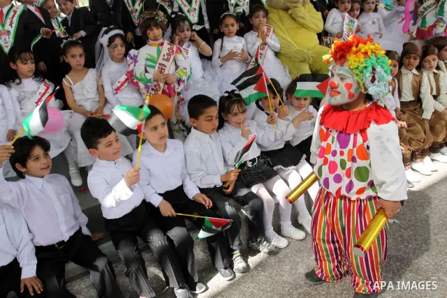 Palestinian children take part in a celebration to mark the International Children Day in Gaza city on April, 15, 2012. Photo by Mohammed Asad