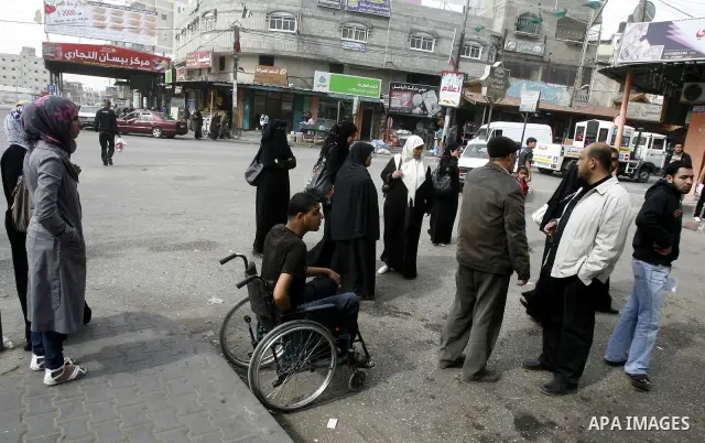 Palestinians wait a taxis in the street after the fuel shortage in Rafah in Gaza Strip on April, 15, 2012. Palestinians in the Gaza Strip are suffering a crisis of dry petrol pumps and frequent blackouts triggered by a f...