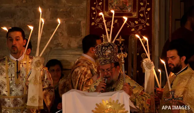 Palestinian Christians take part in the "Holy Fire" procession on the eve of Orthodox Easter in Gaza city on April 14, 2012. The date of Orthodox Easter is calculated differently than by the Roman Catholics and other chu...