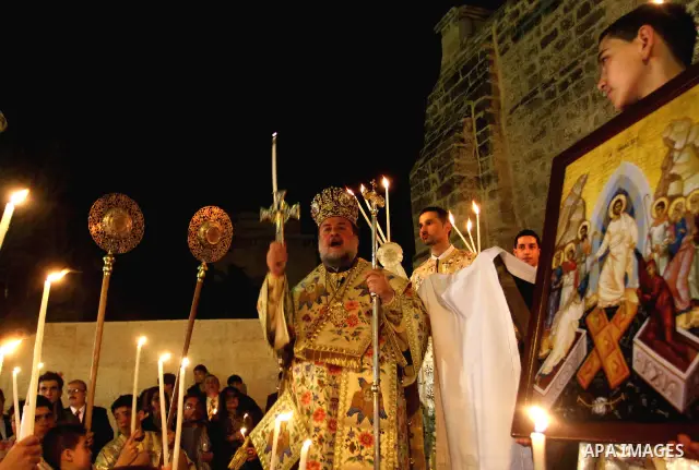 Palestinian Christians take part in the "Holy Fire" procession on the eve of Orthodox Easter in Gaza city on April 14, 2012. The date of Orthodox Easter is calculated differently than by the Roman Catholics and other chu...