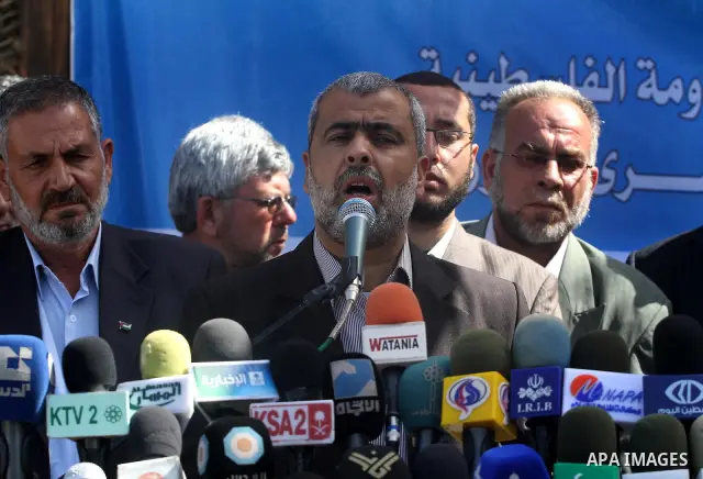 Palestinian factions speak during press conference to discus the issue of prisoners during a protest calling for the release of Palestinian prisoners held in Israeli jails inside the grounds of the Red Cross office in Ga...
