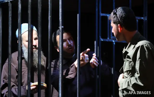 Palestinians perform a play depicting Palestinian prisoners in an Israeli jail in Gaza City on April 16, 2012 on the eve of Prisoners' Day, an annual event during which people hold demonstrations and rallies of solidarit...
