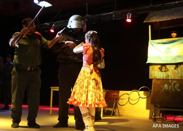 Palestinians perform a play depicting Palestinian prisoners in an Israeli jail in Gaza City on April 16, 2012 on the eve of Prisoners' Day, an annual event during which people hold demonstrations and rallies of solidarit...