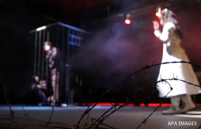 Palestinians perform a play depicting Palestinian prisoners in an Israeli jail in Gaza City on April 16, 2012 on the eve of Prisoners' Day, an annual event during which people hold demonstrations and rallies of solidarit...