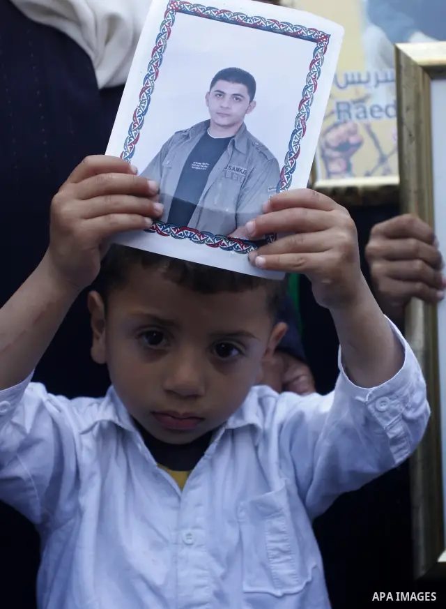 Palestinians participate in a demonstration calling for the release of Palestinian prisoners jailed in Israel, in the West Bank city of Nablus,Israel is currently 1,200 of Palestinians in its prisons. have begun a hunger...