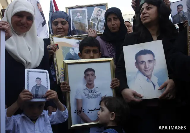 Palestinians participate in a demonstration calling for the release of Palestinian prisoners jailed in Israel, in the West Bank city of Nablus,Israel is currently 1,200 of Palestinians in its prisons. have begun a hunger...