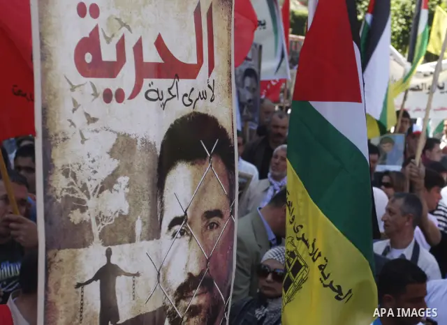 Palestinians participate in a demonstration calling for the release of Palestinian prisoners jailed in Israel, in the West Bank city of Nablus,Israel is currently 1,200 of Palestinians in its prisons. have begun a hunger...