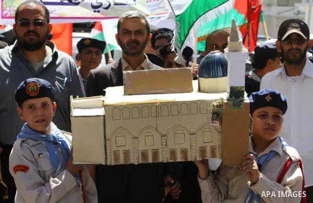 Palestinians demonstrate in solidarity with prisoners jailed in Israel on the annual prisoners day, in Gaza City, Tuesday, April 17, 2012. The Israeli prison service said Tuesday hundreds of Palestinian prisoners have la...
