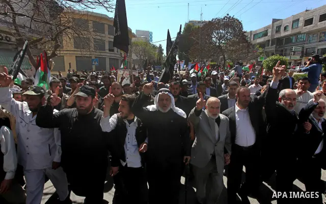 Palestinian factions demonstrate in solidarity with prisoners jailed in Israel on the annual prisoners day, in Gaza City, Tuesday, April 17, 2012. The Israeli prison service said Tuesday hundreds of Palestinian prisoners...