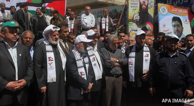 Palestinian factions demonstrate in solidarity with prisoners jailed in Israel on the annual prisoners day, in Gaza City, Tuesday, April 17, 2012. The Israeli prison service said Tuesday hundreds of Palestinian prisoners...