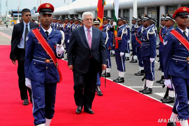 Palestinian President Mahmoud Abbas, received by Maldives President, Mohammed Waheed Hassan, upon arrival at the airport in Male, Maldives, Tuesday, April 17, 2012. Photo by Thaer Ganaim