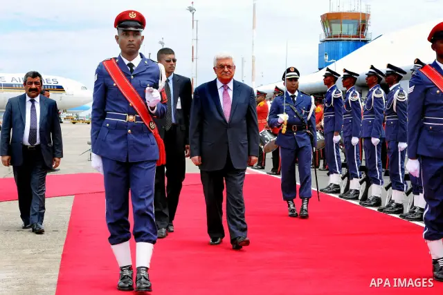 Palestinian President Mahmoud Abbas, received by Maldives President, Mohammed Waheed Hassan, upon arrival at the airport in Male, Maldives, Tuesday, April 17, 2012. Photo by Thaer Ganaim