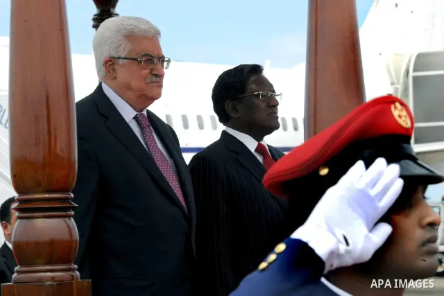 Palestinian President Mahmoud Abbas, received by Maldives President, Mohammed Waheed Hassan, upon arrival at the airport in Male, Maldives, Tuesday, April 17, 2012. Photo by Thaer Ganaim
