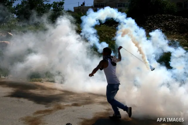 A Palestinian protester accidentally sets himself on fire throwing a Molotov cocktail towards the Israeli soldiers during clashes following a demonstration to mark the Prisoners' Day near Israels Ofer prison, between Je...
