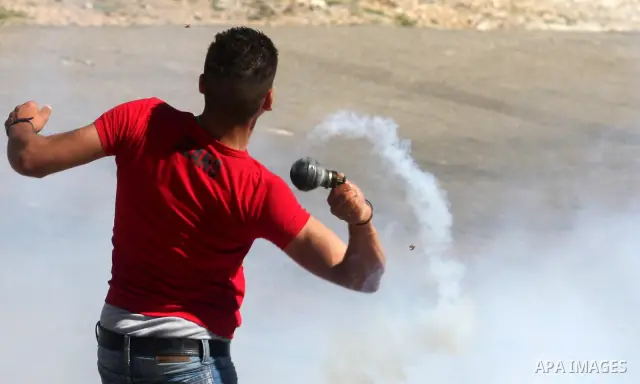 A Palestinian protester accidentally sets himself on fire throwing a Molotov cocktail towards the Israeli soldiers during clashes following a demonstration to mark the Prisoners' Day near Israels Ofer prison, between Je...