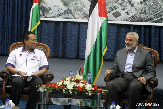 Palestinian Prime Minister in Gaza Strip, Ismail Haniya receives Malaysia delegation in his office in Gaza city on April 18, 2012. Photo by Mohammed As