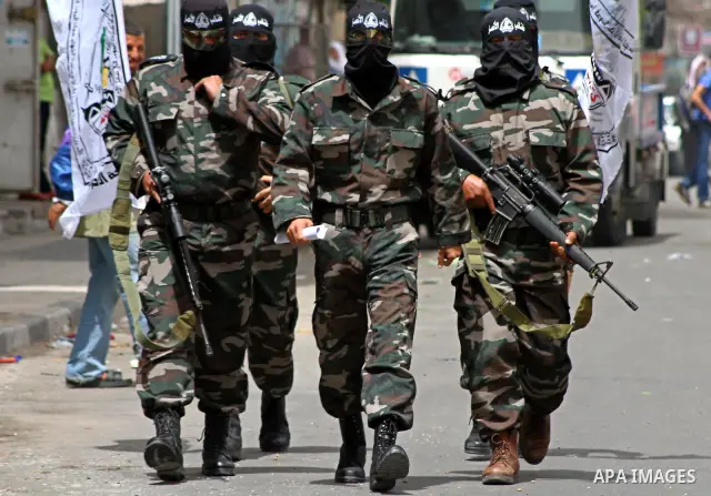 Palestinian militants of the Al-Ahrar Brigades, take part in a press conference, in Gaza city on April, 18, 2012 to announces readiness to defend the Palestinian prisoners in Israeli jails. Photo by Ashraf Amra