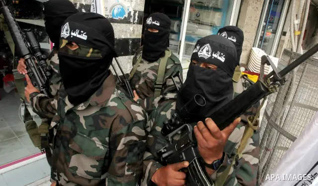 Palestinian militants of the Al-Ahrar Brigades, take part in a press conference, in Gaza city on April, 18, 2012 to announces readiness to defend the Palestinian prisoners in Israeli jails. Photo by Ashraf Amra