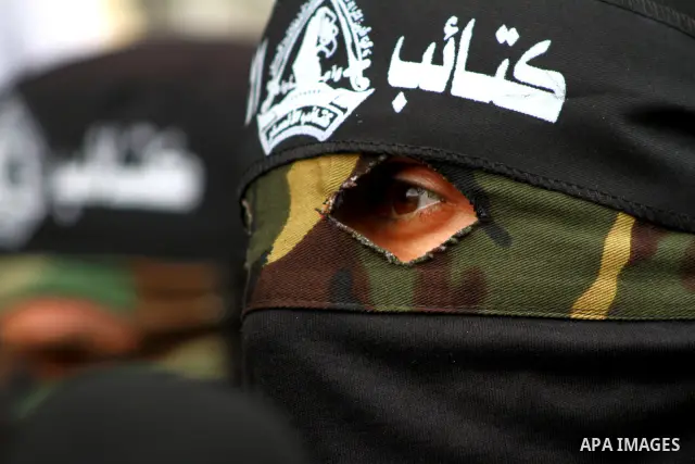 Palestinian militants of the Al-Ahrar Brigades, take part in a press conference, in Gaza city on April, 18, 2012 to announces readiness to defend the Palestinian prisoners in Israeli jails. Photo by Ashraf Amra