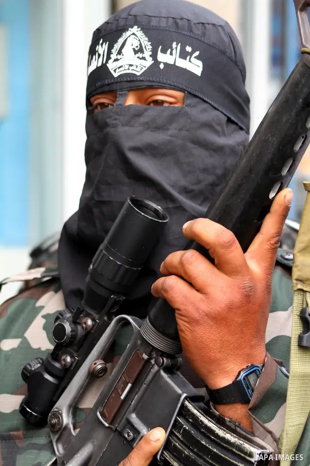 Palestinian militants of the Al-Ahrar Brigades, take part in a press conference, in Gaza city on April, 18, 2012 to announces readiness to defend the Palestinian prisoners in Israeli jails. Photo by Ashraf Amra