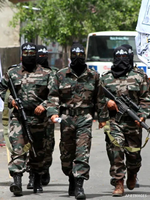 Palestinian militants of the Al-Ahrar Brigades, take part in a press conference, in Gaza city on April, 18, 2012 to announces readiness to defend the Palestinian prisoners in Israeli jails. Photo by Ashraf Amra