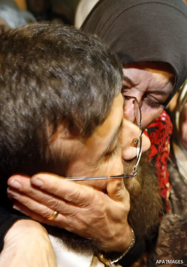 Khader Adnan, a member of Islamic Jihad, gestures upon his arrival in the West Bank village of Arabe near Jenin after his release from an Israeli prison, April 17, 2012. Adnan, a prisoner who refused food for 66 days bef...