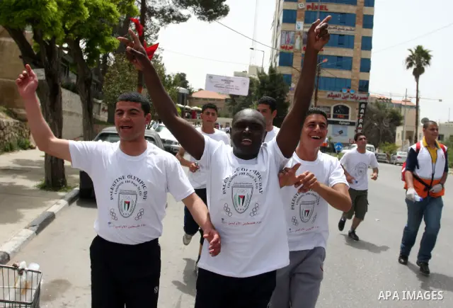 Palestinian athletes ran in the Olympic Marathon (100 days before the start of the London Olympics 2012) in the West Bank city of Ramallah April 18, 2012. Photo by Issam Rimawi