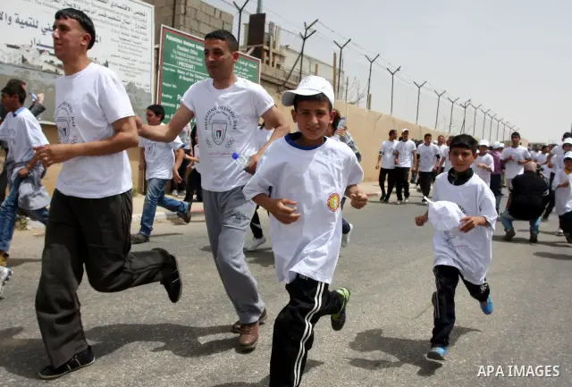 Palestinian athletes ran in the Olympic Marathon (100 days before the start of the London Olympics 2012) in the West Bank city of Ramallah April 18, 2012. Photo by Issam Rimawi