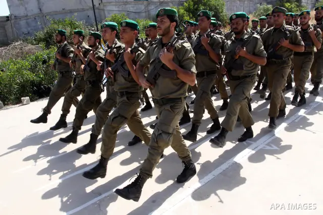 Palestinian Hamas National security force officers stand to attention during their graduation ceremony in Gaza City on April 19, 2012. Photo by Mohammed Asad