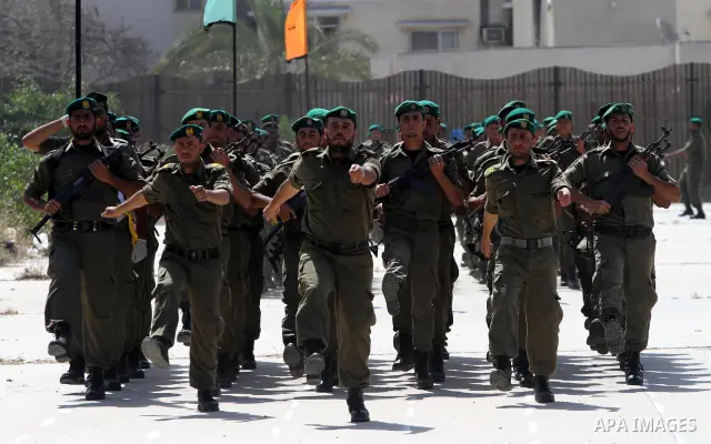 Palestinian Hamas National security force officers stand to attention during their graduation ceremony in Gaza City on April 19, 2012. Photo by Mohammed Asad