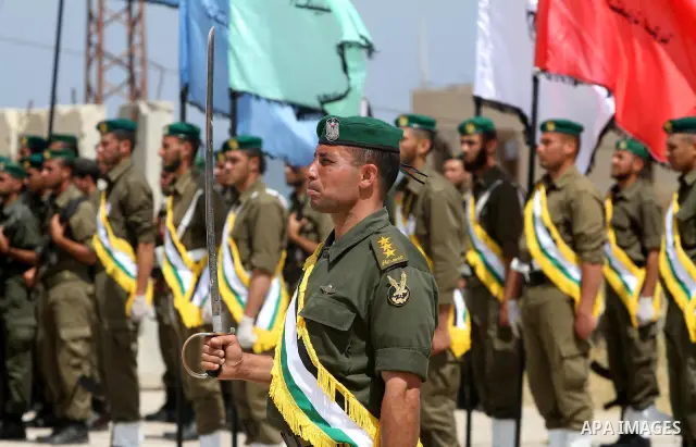 Palestinian Hamas National security force officers stand to attention during their graduation ceremony in Gaza City on April 19, 2012. Photo by Mohammed Asad