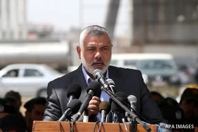 Palestinian Prime Minister in Gaza Strip, Ismail Haniya, speaks during a graduation ceremony of National security force officers in Gaza City on April 19, 2012. Photo by Mohammed Asad